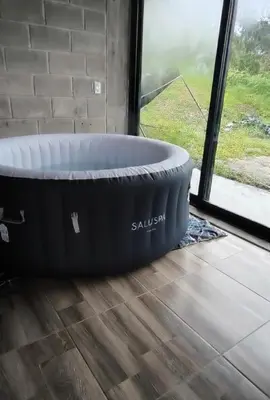 a large bath tub sitting in a room with a window at Casa Finca cerca al embalse Jaguas San Roque Antioquia