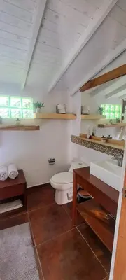 a bathroom with a toilet and a sink at Casa Refugio in Envigado