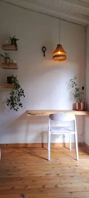 a white table with a white chair in a room at Casa Refugio in Envigado