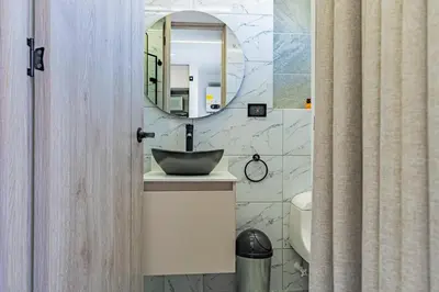 a bathroom with a sink and a mirror at Apartaloft exclusivo en laureles in Medellín