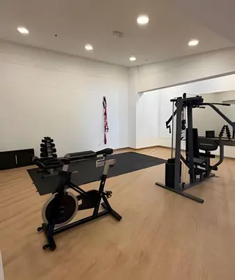 a gym with two tread machines in a room at Lujoso con linda vista - Estrato 6 in Manizales