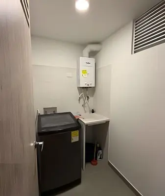 a room with a small refrigerator and a sink at Lujoso con linda vista - Estrato 6 in Manizales