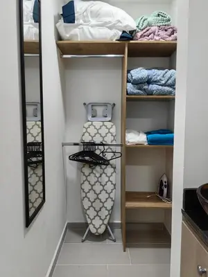 a walk in closet with shelves and towels at Apartaestudio completo en Itagüí - Shalom - 201 in Itagüí