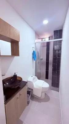 a bathroom with a toilet and a sink and a shower at Apartaestudio completo en Itagüí - Shalom - 201 in Itagüí