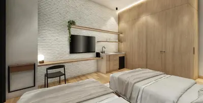 a bedroom with two beds and a sink and a tv at Autenthico X Atempo Local Hotel & Suites Medellin in Medellín