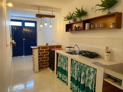 a kitchen with a sink and a counter top at Acogedor apartaestudio cerca al parque principal in Jardin