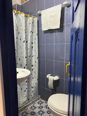 a bathroom with a toilet and a sink at Acogedor apartaestudio cerca al parque principal in Jardin