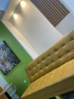 a ceiling with a couch in a room at la huerta de 1 alcoba in Medellín