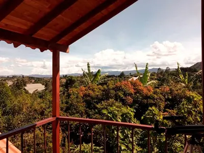 a view from the balcony of a house at Cabaña Sensorial Vista y Silencio Total a 40 minutos de Medellín in San Vicente