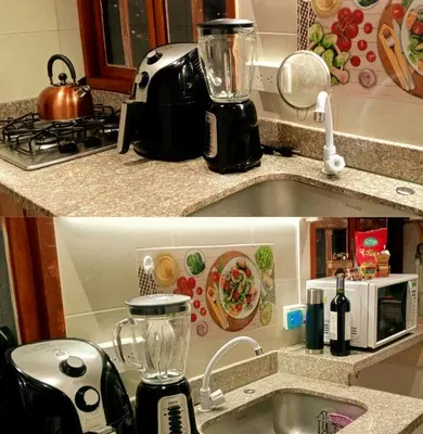 a kitchen counter with a blender and a sink at Cabaña Sensorial Vista y Silencio Total a 40 minutos de Medellín in San Vicente