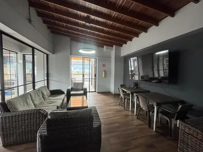 a living room with a couch and a table at Aluna in Estación El Salto