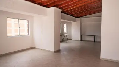 an empty room with white walls and a wooden ceiling at 801-Acogedor Apto 2BR Parque Sabaneta in Sabaneta
