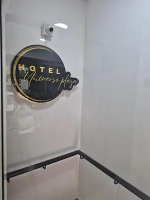 a sign on the wall of a hotel emergency room at hotel universo plaza in Medellín