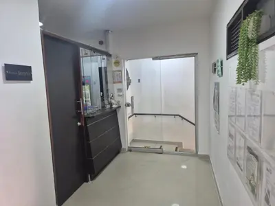 a bathroom with a door and a walk in shower at hotel universo plaza in Medellín
