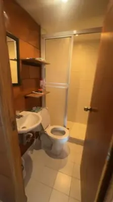a bathroom with a toilet and a sink at Camino de los Vientos in Bello