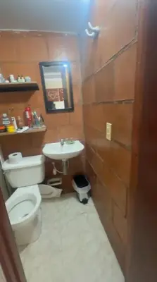 a bathroom with a toilet and a sink at Camino de los Vientos in Bello