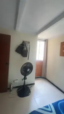 a room with a lamp in the corner of a room at Camino de los Vientos in Bello