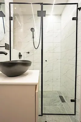 a bathroom with a sink and a glass shower at prime loft 72 laureles in Medellín