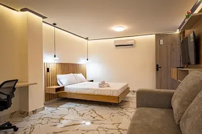 a small room with a bed and a couch at prime loft 72 laureles in Medellín