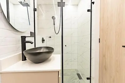 a bathroom with a bowl sink and a shower at prime loft 72 laureles in Medellín