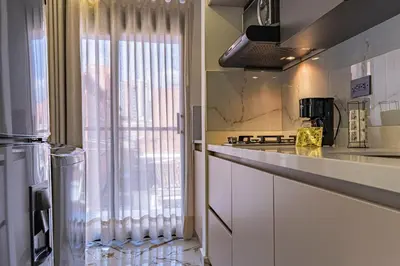 a kitchen with a counter and a sink and a window at Exclusivo Urban Loft en Laureles in Medellín