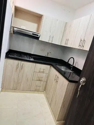 a kitchen with a sink and a microwave at Studio apartment in Laureles, ideal central location in Medellín