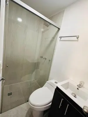 a bathroom with a shower and a toilet and a sink at Studio apartment in Laureles, ideal central location in Medellín