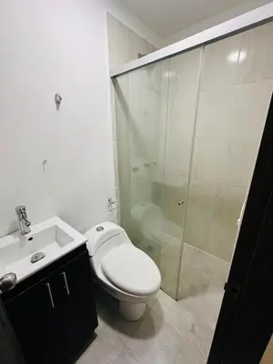 a bathroom with a toilet and a shower and a sink at Studio apartment in Laureles, ideal central location in Medellín