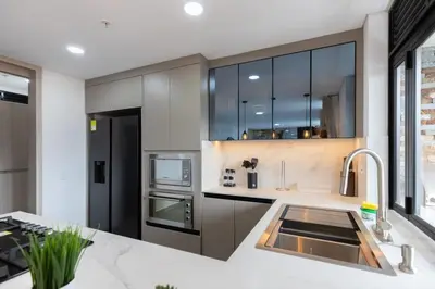 a kitchen with stainless steel appliances and a sink at Exclusivo apartamento en laureles cerca al estadio in Medellín