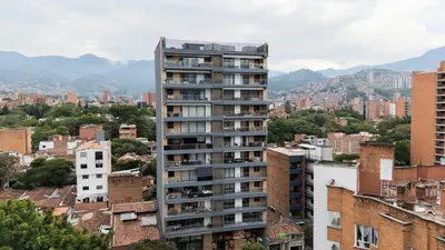 a tall apartment building in a city with buildings at Exclusivo apartamento en laureles cerca al estadio in Medellín