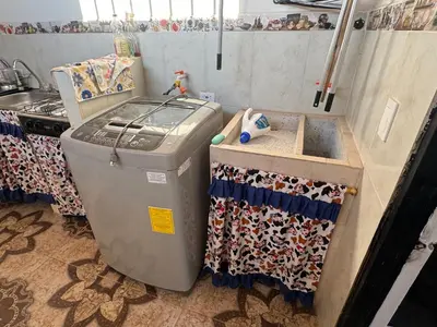 a trash can in a kitchen with a sink at Lucena place in La Dorada