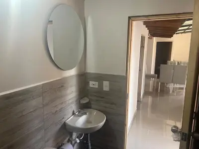 a bathroom with a sink and a mirror at Hermoso apartamento con excelente ubicación in Medellín
