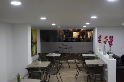 a dining room with tables and chairs in a restaurant at Element Hotel in Medellín