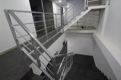 a staircase in a building with a metal railing at Element Hotel in Medellín