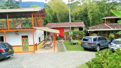 a group of cars parked in front of a house at Kantarrana Casa de Campo in Jardin