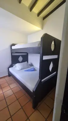 a black bunk bed in a room at San Jeronimo Cabaña in San Jerónimo