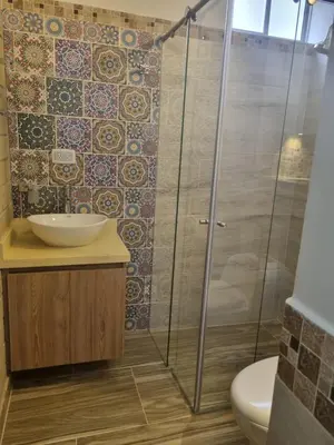 a bathroom with a shower and a sink at San Jeronimo Cabaña in San Jerónimo
