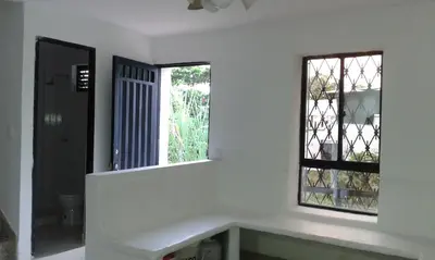a bathroom with a sink and a window at Cabaña Familiar La Aldea Doradal in Gesen