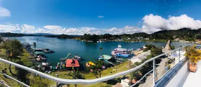 a view of a river with boats in the water at Aptos vista al Embalse, frente al lago, Restaurantes, Bares in Guatapé