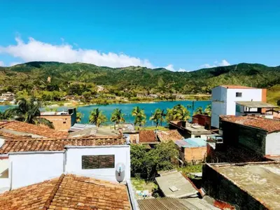 a view of a town with a body of water at Aptos vista al Embalse, frente al lago, Restaurantes, Bares in Guatapé