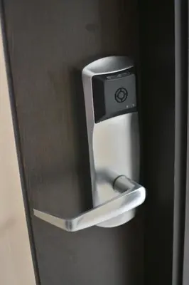 a close up of a doorhandle on a refrigerator at Hotel Granada Plaza in Manizales