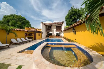 a swimming pool in the backyard of a house at Nueva Granada Hotel Colonial -Centro Histórico- in Santa Fe de Antioquia