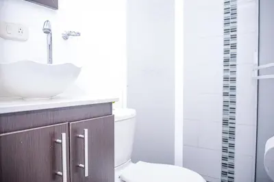 a bathroom with a sink and a toilet at Manilla House in Medellín