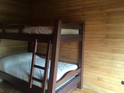 a couple of bunk beds in a cabin at Cabañas el Retorno in Guatapé