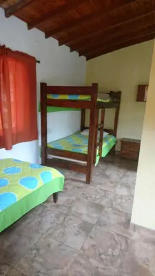 a bedroom with two bunk beds in a room at Finca Hotel La Ponderosa in Rionegro
