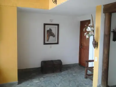 a hallway with a picture of a horse on the wall at Finca Hotel La Ponderosa in Rionegro