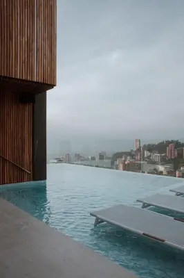 a swimming pool on top of a building at Binn Hotel in Medellín