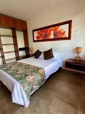 a bedroom with a bed and a picture on the wall at Finca Hotel Villa Clara in Chinchiná