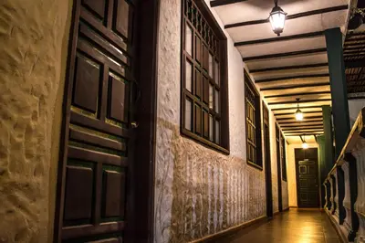 an empty hallway with a door and windows at Hotel El Virrey Boutique Honda in Honda