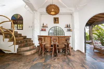 a dining room with a table and chairs at The Secret Buddha in Medellín
